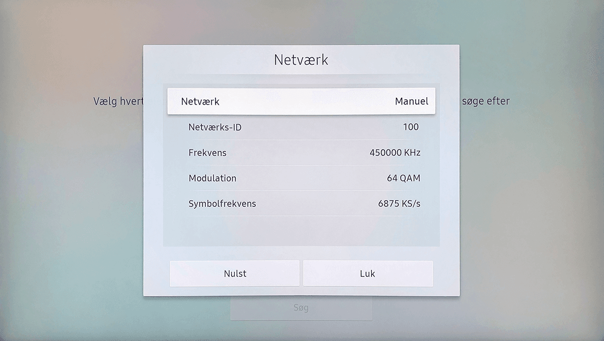 Netværksindstillinger med frekvens 450000 KHz, modulation 64 QAM og symbolfrekvens 6875 KS/s til manuel netværkssøgning.